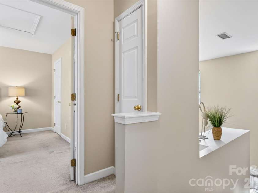 18310 Taffrail Way, Cornelius, NC 28031.  MLS# CAR4372401, YatesRealty ID 23659. Hallway with linen closet