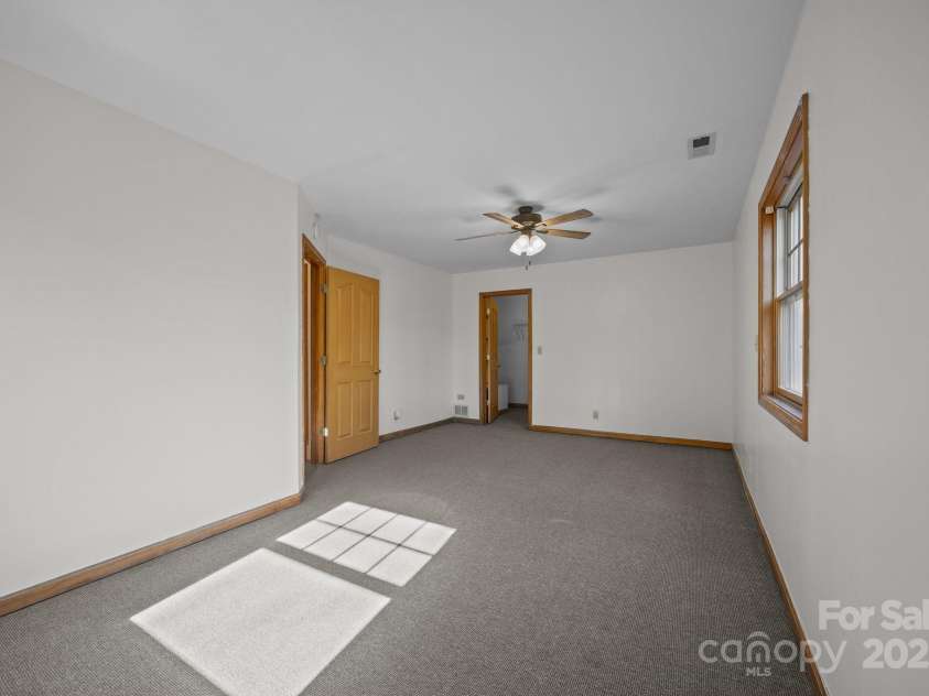 390 Hollow Wood Lane, Tryon, NC 28782.  MLS# CAR4185566, YatesRealty ID 23663. 