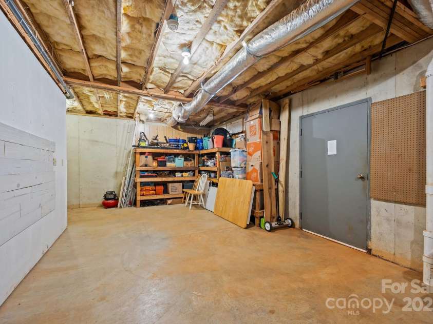 390 Hollow Wood Lane, Tryon, NC 28782.  MLS# CAR4185566, YatesRealty ID 23663. 