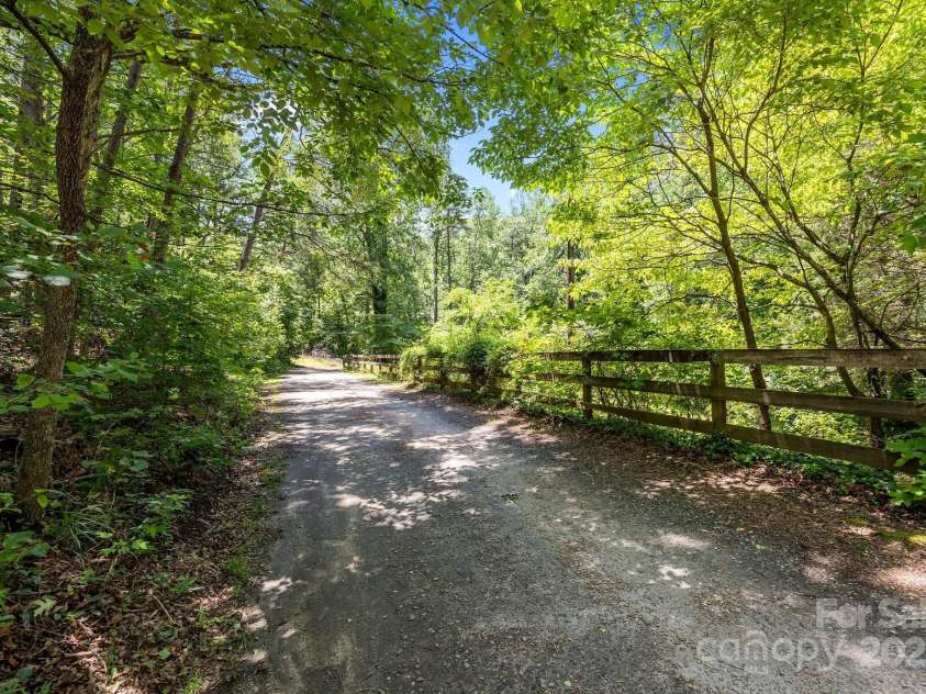 390 Hollow Wood Lane, Tryon, NC 28782.  MLS# CAR4185566, YatesRealty ID 23663. 