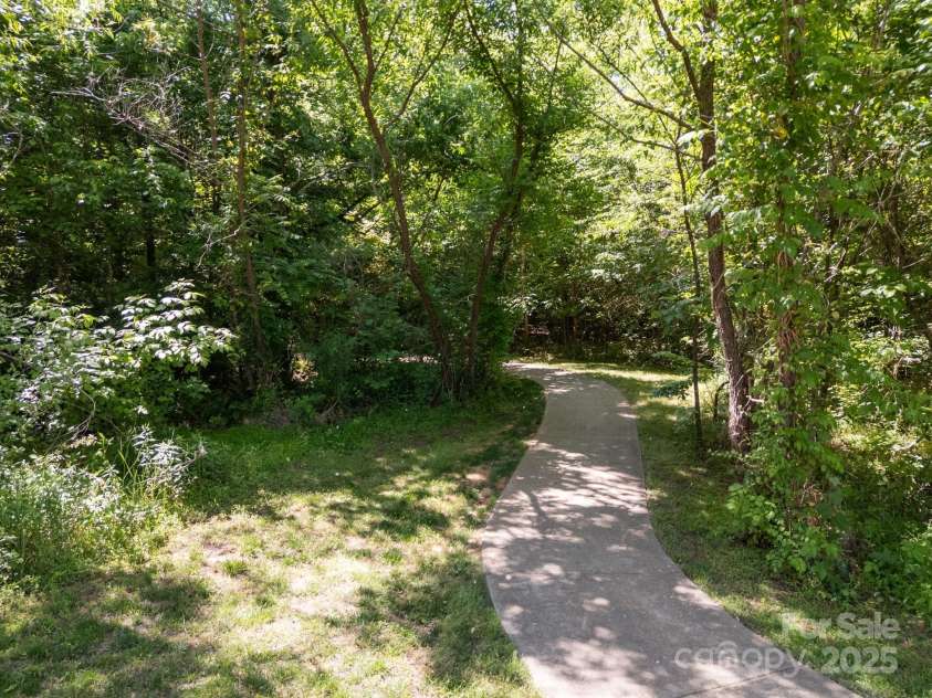 9871 Travertine Trail, Davidson, NC 28036.  MLS# CAR4254915, YatesRealty ID 23668. Community walking trails.
