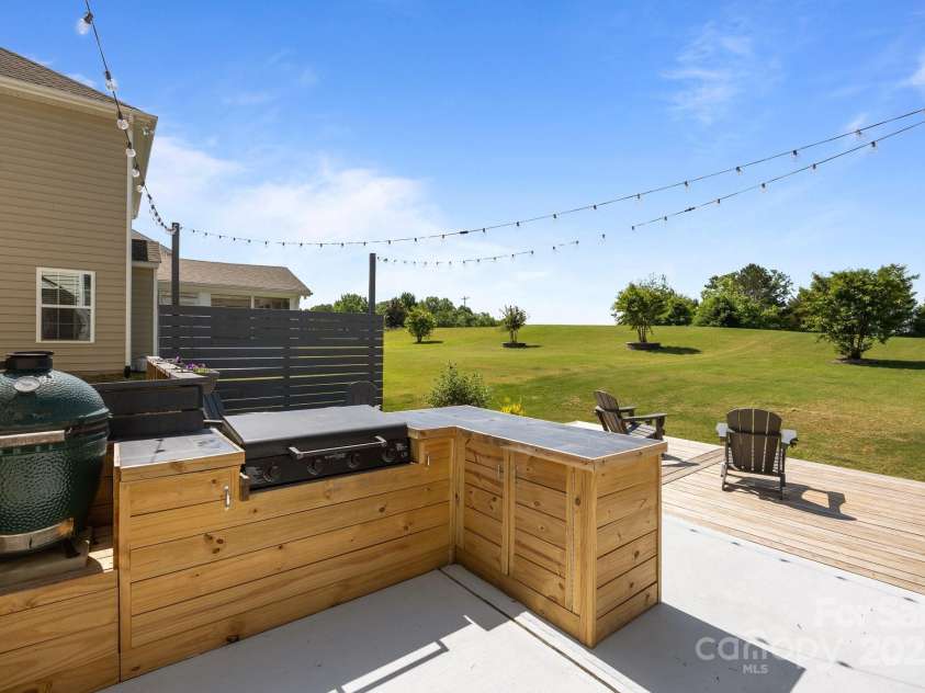 9871 Travertine Trail, Davidson, NC 28036.  MLS# CAR4254915, YatesRealty ID 23668. Custom outdoor kitchen **BLACKSTONE INCLUDED**