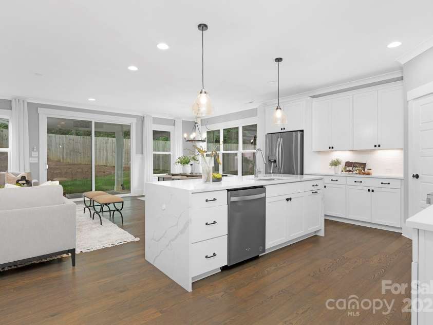 2517 Marlowe Avenue, Charlotte, NC 28208.  MLS# CAR4263015, YatesRealty ID 23670. A wall of windows invites the outdoors in while preserving a sense of privacy, offering the best of both worlds.