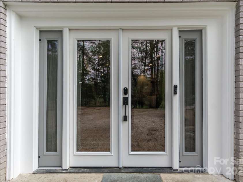 143 Oakview Road, Asheville, NC 28806.  MLS# CAR4252612, YatesRealty ID 23673. French doors downstairs