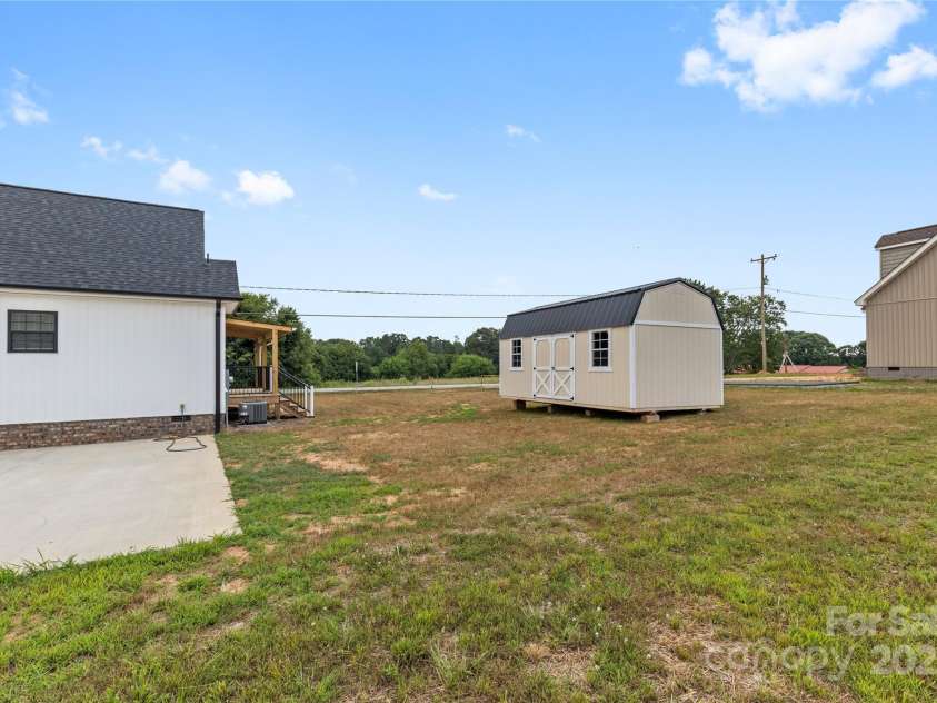 3511 Warlicks Church Road, Connelly Springs, NC 28612.  MLS# CAR4274924, YatesRealty ID 23680. Back yard and shed