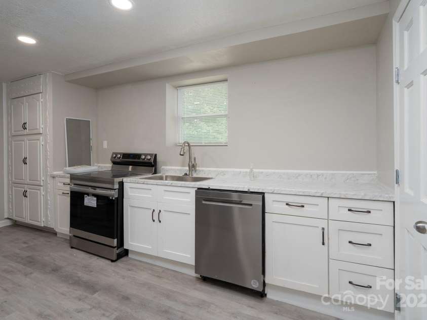 2617 Shady Lane Avenue, Concord, NC 28027.  MLS# CAR4268021, YatesRealty ID 23686. Basement Main - Kitchen
