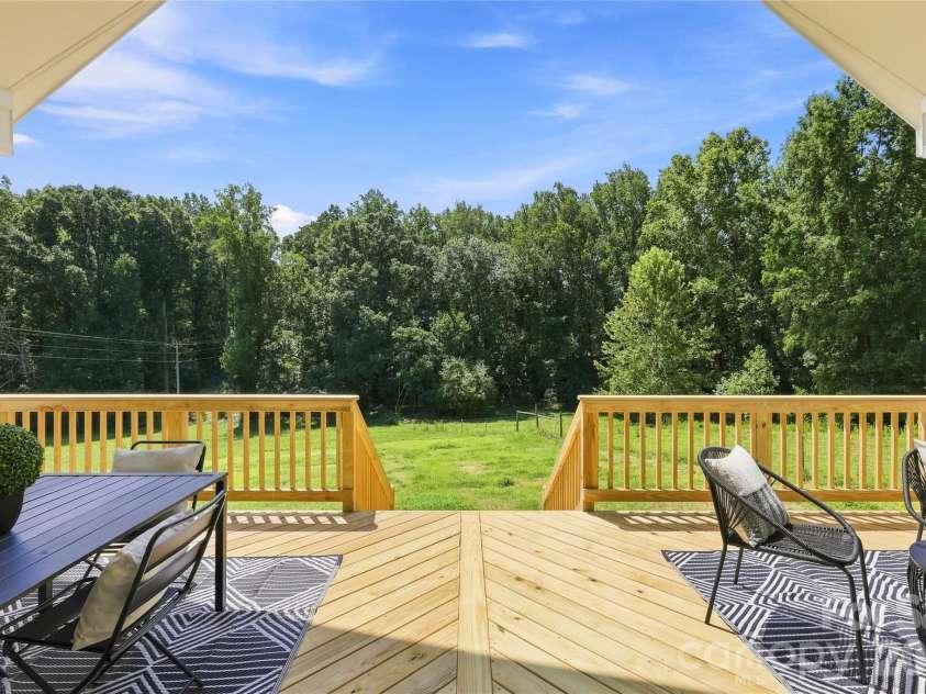 9745 Flowes Store Road, Midland, NC 28107.  MLS# CAR4383070, YatesRealty ID 23689. Representative of previous built Arbor: back covered deck