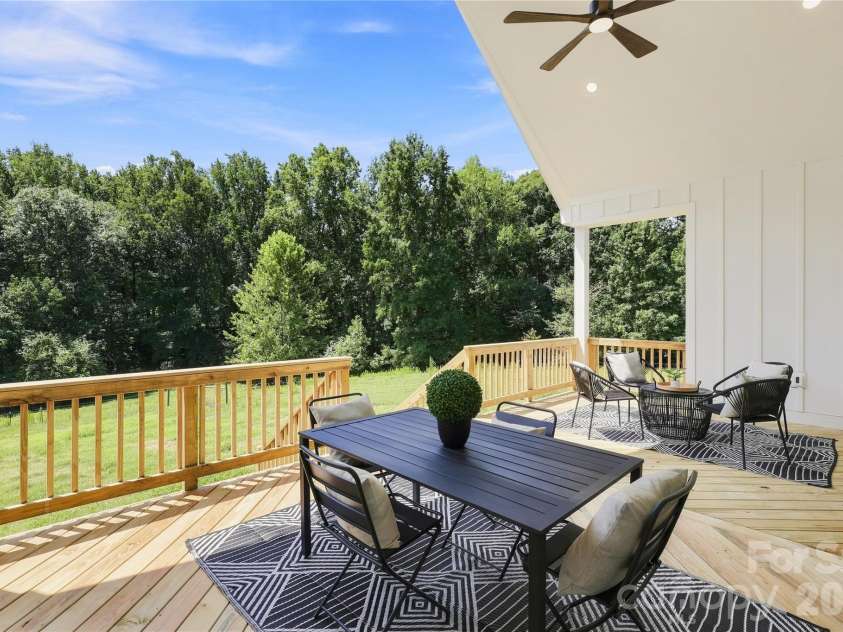 9745 Flowes Store Road, Midland, NC 28107.  MLS# CAR4383070, YatesRealty ID 23689. Representative of previous built Arbor: back covered deck