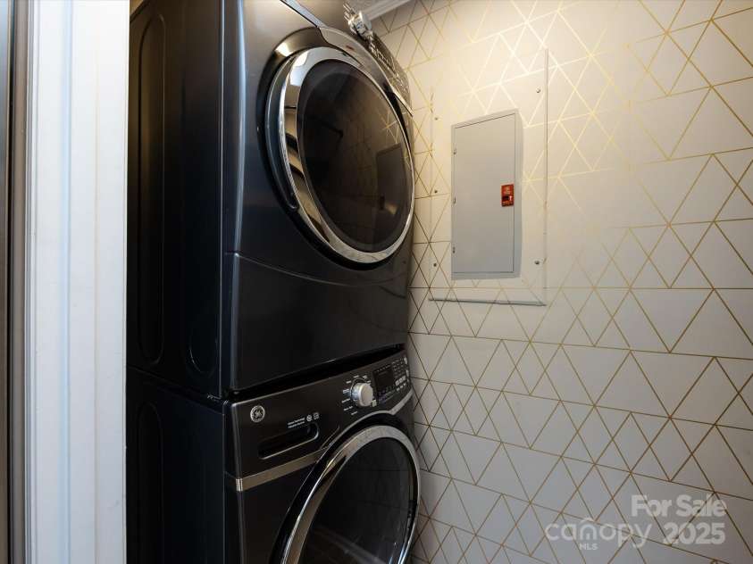 7960 Tiburon Circle, Charlotte, NC 28215.  MLS# CAR4276761, YatesRealty ID 23690. Laundry room closet off the kitchen with washer/dryer (less than 3 years old).