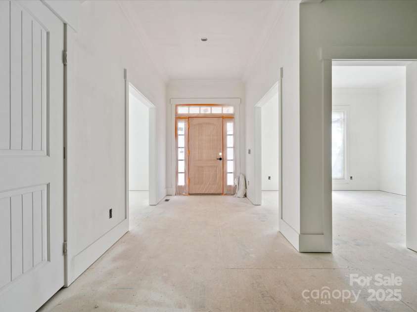 8018 Fairmont Drive, Waxhaw, NC 28173.  MLS# CAR4276331, YatesRealty ID 23700. Foyer with dining room to right and office to left