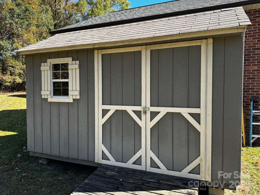 1080 Gin Road, Gold Hill, NC 28071.  MLS# CAR4308505, YatesRealty ID 2371. She for the yard tools. 