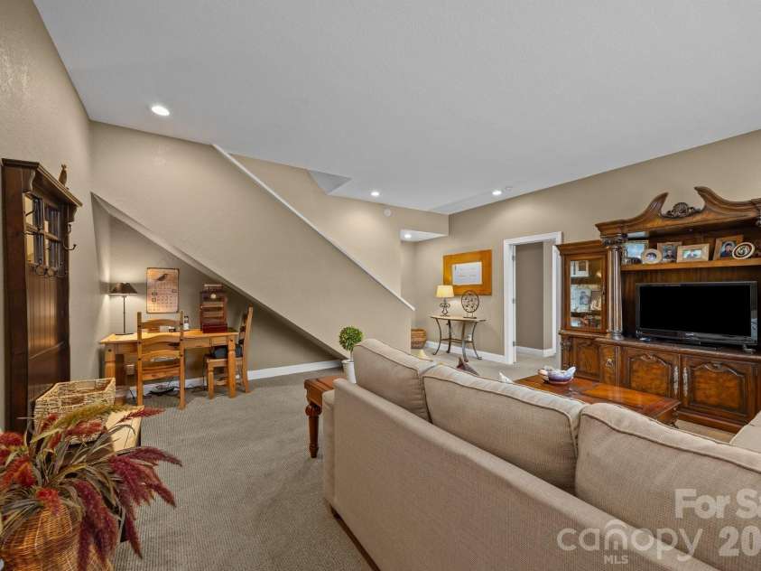 43 Smokemont Drive, Arden, NC 28704.  MLS# CAR4383229, YatesRealty ID 23718. Lower level den for private entertaining.