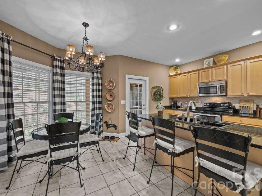 43 Smokemont Drive, Arden, NC 28704.  MLS# CAR4383229, YatesRealty ID 23718. Use the bar, breakfast table or both in this space.