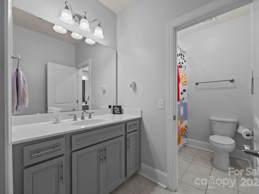 10904 Kilkenny Drive, Matthews, NC 28105.  MLS# CAR4242460, YatesRealty ID 23738. Bath attached to bedrooms 2 & 3