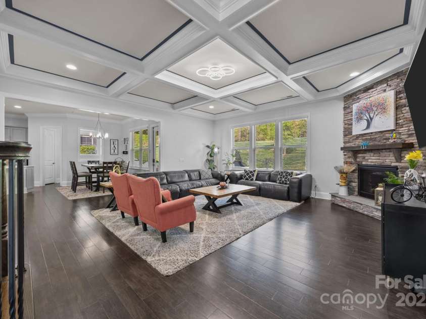 10904 Kilkenny Drive, Matthews, NC 28105.  MLS# CAR4242460, YatesRealty ID 23738. Living room with coffered ceiling