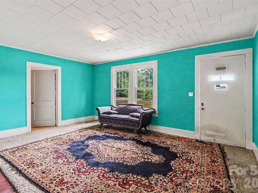 1116 Medlin Road, Monroe, NC 28112.  MLS# CAR4378370, YatesRealty ID 23742. Formal Front Living Room
