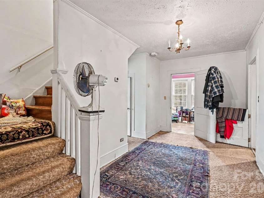 1116 Medlin Road, Monroe, NC 28112.  MLS# CAR4378370, YatesRealty ID 23742. Hallway with stairs to 2nd floor