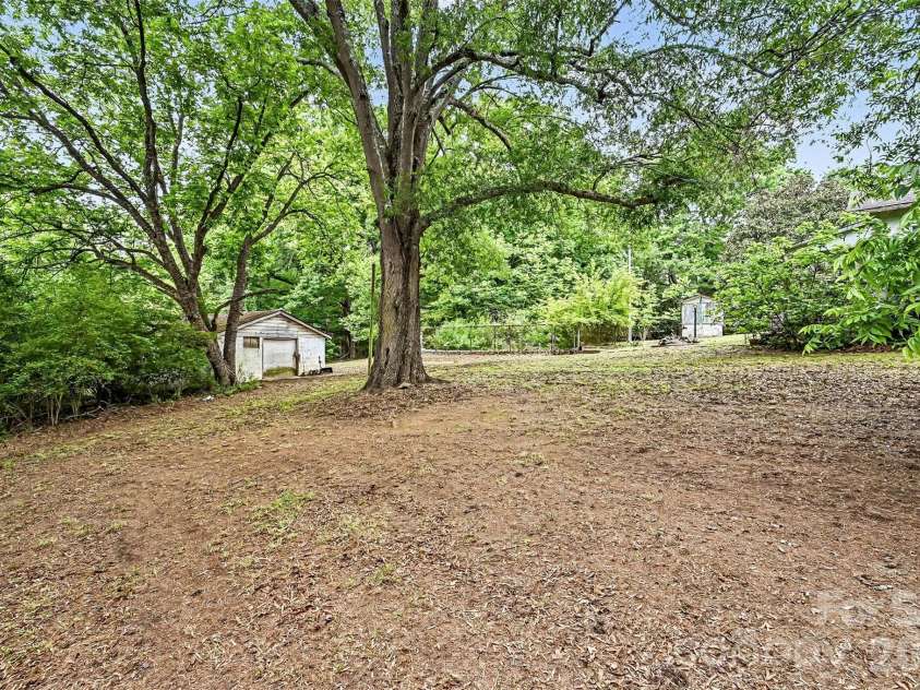 1116 Medlin Road, Monroe, NC 28112.  MLS# CAR4378370, YatesRealty ID 23742. Spacious yard and storage shed