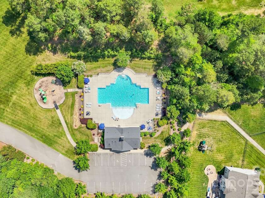 11618 Macallano Drive, Charlotte, NC 28215.  MLS# CAR4268252, YatesRealty ID 23742. Aerial view of community pool & playground