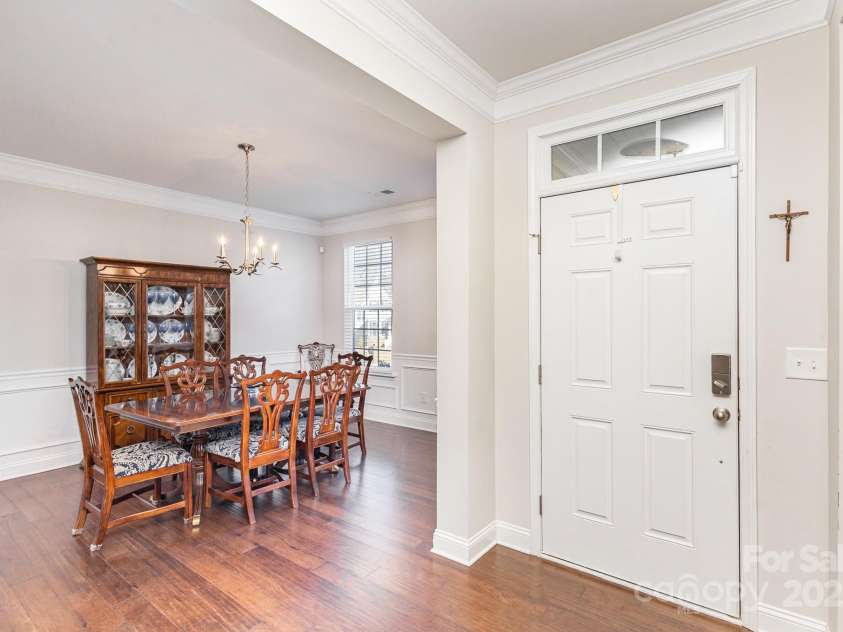 11618 Macallano Drive, Charlotte, NC 28215.  MLS# CAR4268252, YatesRealty ID 23742. Dining room & front door
