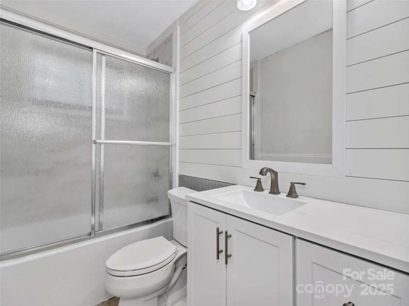 114 Elden Street, Hendersonville, NC 28739.  MLS# CAR4270010, YatesRealty ID 23743. Lower unit bath