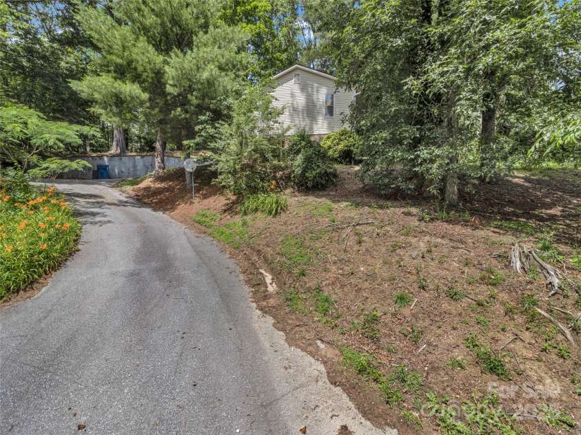 114 Elden Street, Hendersonville, NC 28739.  MLS# CAR4270010, YatesRealty ID 23743. Serene wooded setting