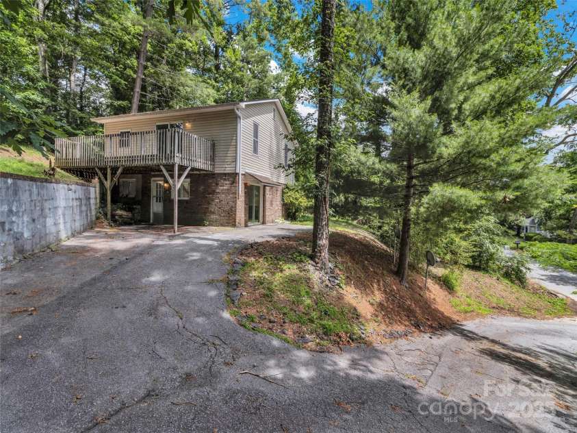 114 Elden Street, Hendersonville, NC 28739.  MLS# CAR4270010, YatesRealty ID 23743. Tree line facing street
