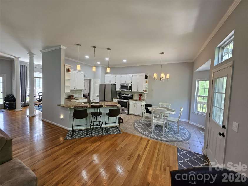 11632 Long Forest Drive, Charlotte, NC 28269.  MLS# CAR4369934, YatesRealty ID 23743. Kitchen + Dining Area