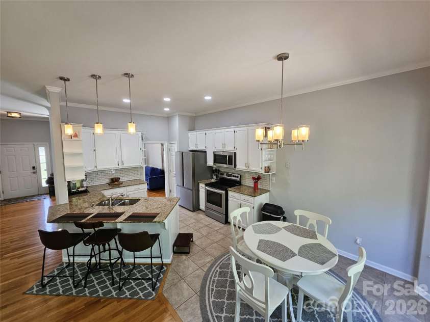 11632 Long Forest Drive, Charlotte, NC 28269.  MLS# CAR4369934, YatesRealty ID 23743. Kitchen + Dining Area 