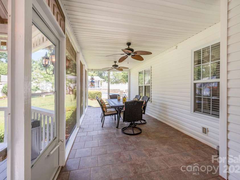 130 Greenwich Drive, Statesville, NC 28677.  MLS# CAR4260511, YatesRealty ID 23750. Back screened porch overlooks the pool and backyard