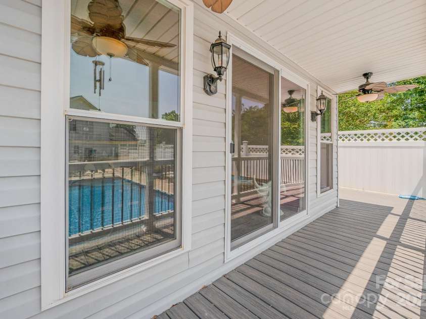130 Greenwich Drive, Statesville, NC 28677.  MLS# CAR4260511, YatesRealty ID 23750. Covered porch for the pool house overlooks the pool