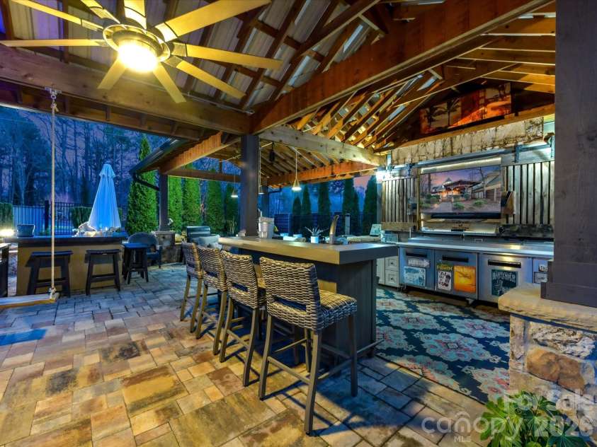 5401 Mountain Point Lane, Charlotte, NC 28216.  MLS# CAR4341424, YatesRealty ID 23753. Poolside Bar and Kitchen with Television