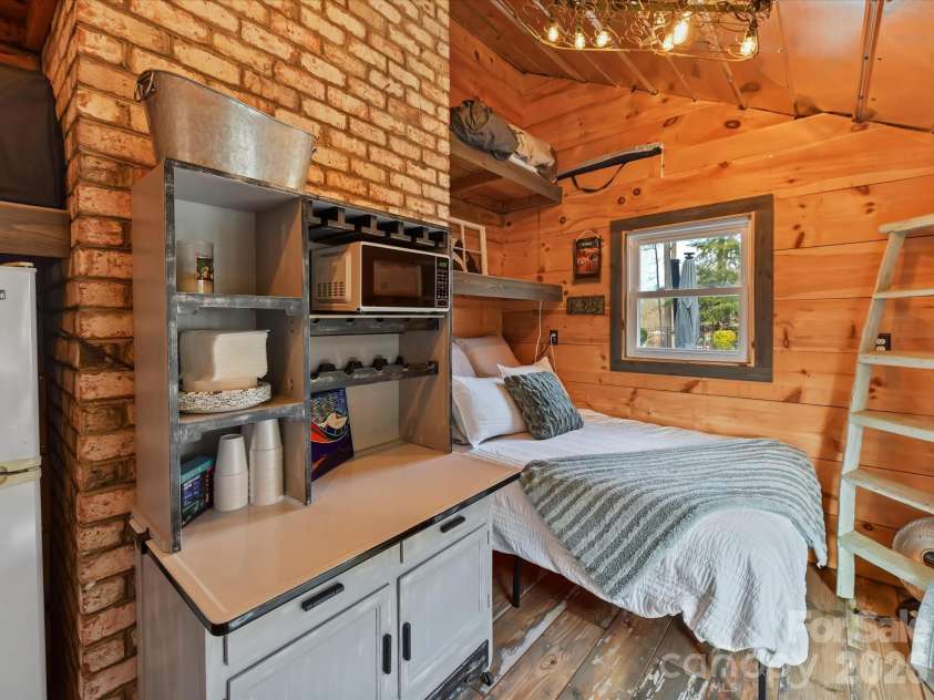 5401 Mountain Point Lane, Charlotte, NC 28216.  MLS# CAR4341424, YatesRealty ID 23753. Poolside Glamping Cabana
