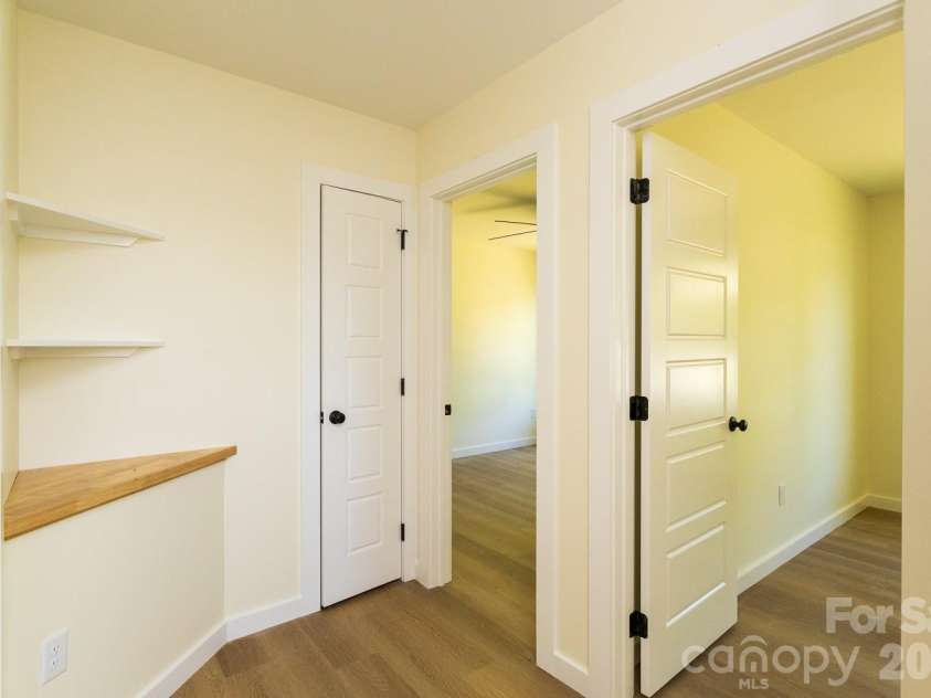 39 Terry Estates Drive, Black Mountain, NC 28711.  MLS# CAR4372396, YatesRealty ID 23756. Linen Closet, storage shelf