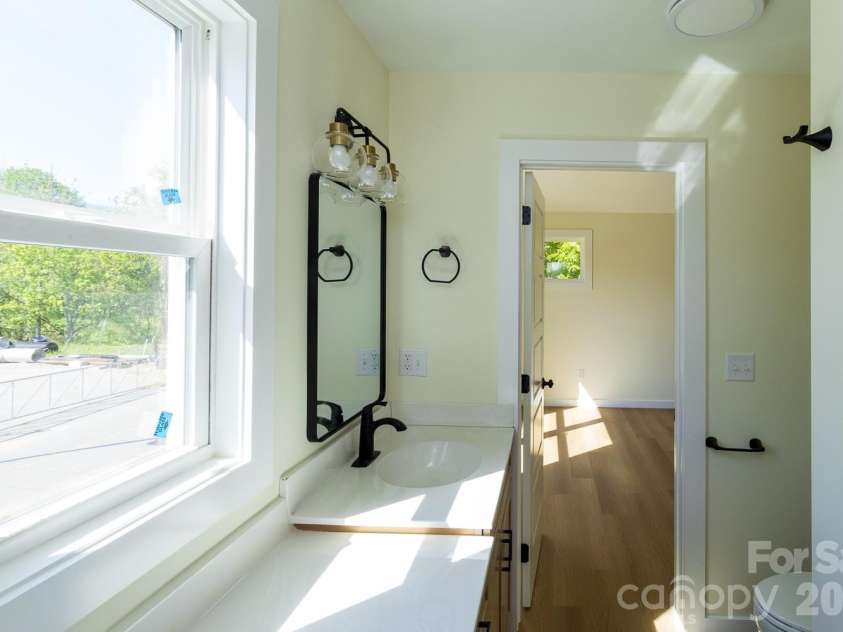 39 Terry Estates Drive, Black Mountain, NC 28711.  MLS# CAR4372396, YatesRealty ID 23756. Looking out  window Master Bath