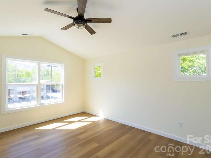 39 Terry Estates Drive, Black Mountain, NC 28711.  MLS# CAR4372396, YatesRealty ID 23756. Primary Light filled Bedroom
