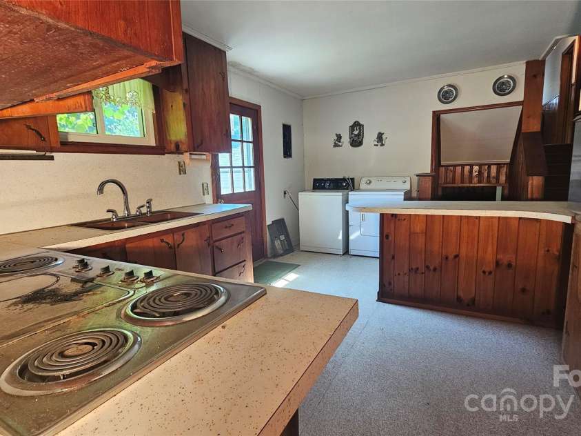 11056 US Highway 52 Highway, Wadesboro, NC 28170.  MLS# CAR4274105, YatesRealty ID 23759. Primary Kitchen and Laundry area