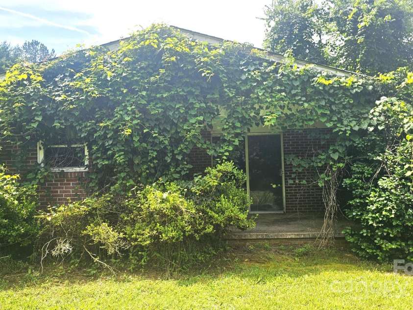 11056 US Highway 52 Highway, Wadesboro, NC 28170.  MLS# CAR4274105, YatesRealty ID 23759. Side Patio Elevation