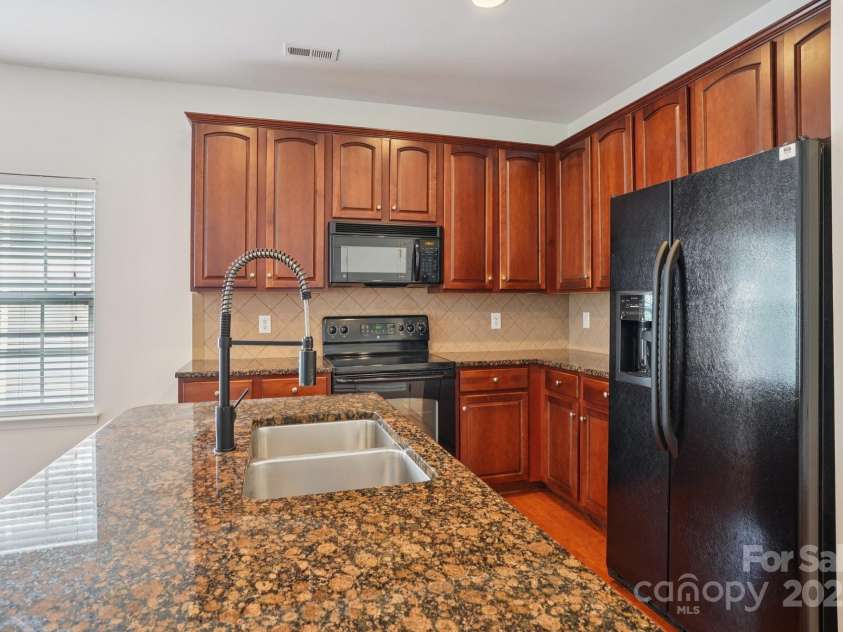 10303 Dominion Village Drive, Charlotte, NC 28269.  MLS# CAR4276725, YatesRealty ID 23760. 