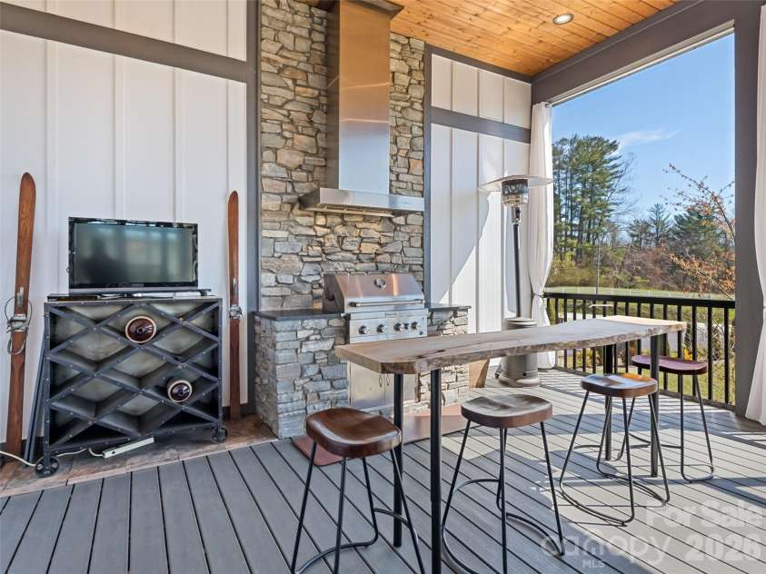717 Daniel Circle Drive, Mills River, NC 28759.  MLS# CAR4355439, YatesRealty ID 23761. Ntastic rear porch grill, beautiful flooring,screened enclosure