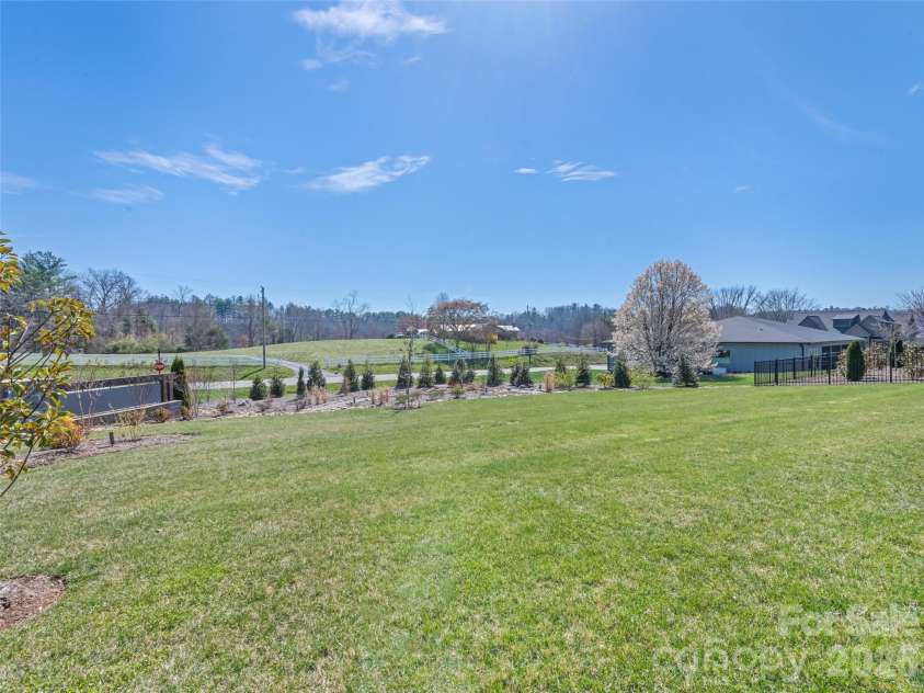 717 Daniel Circle Drive, Mills River, NC 28759.  MLS# CAR4355439, YatesRealty ID 23761. Rear Yard View
