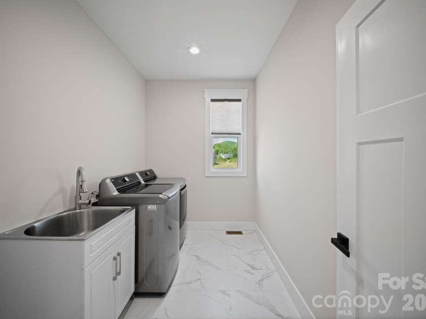 111 Pisgah Gap Drive, Candler, NC 28715.  MLS# CAR4381392, YatesRealty ID 23766. Laundry room 