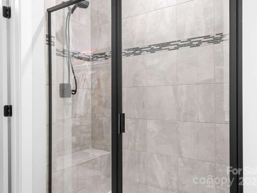 6365 Ashton Park Drive, Denver, NC 28037.  MLS# CAR4272241, YatesRealty ID 23767. Bench In Large Shower With Dual Shower Heads