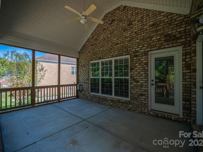 557 Keystone Court, Concord, NC 28027.  MLS# CAR4302108, YatesRealty ID 2377. Screened in porch on back of home