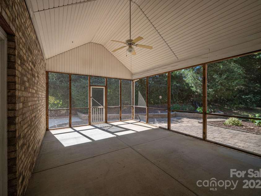 557 Keystone Court, Concord, NC 28027.  MLS# CAR4302108, YatesRealty ID 2377. Screened in porch on side of home