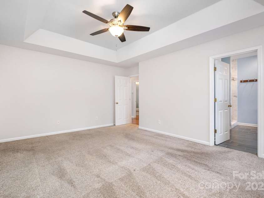 19509 Trintella Lane, Cornelius, NC 28031.  MLS# CAR4271357, YatesRealty ID 23771. Primary Suite with Trayed Ceilings