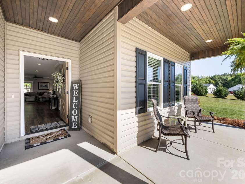 147 Haystack Lane, Olin, NC 28660.  MLS# CAR4375441, YatesRealty ID 23772. Covered front porch with handsome bead-board ceiling