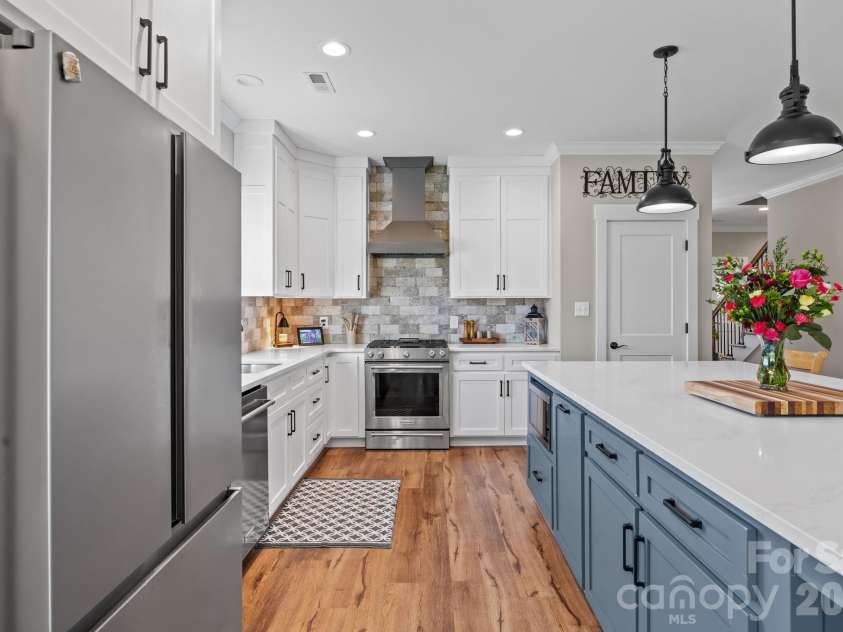 147 Haystack Lane, Olin, NC 28660.  MLS# CAR4375441, YatesRealty ID 23772. Elegant tile backsplash compliments the gorgeous cabinets and counter tops.