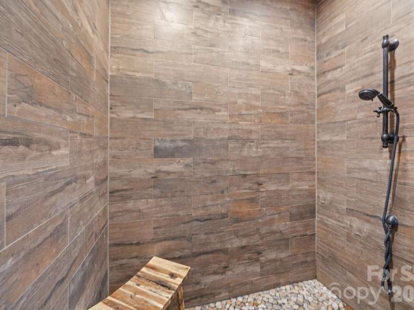 147 Haystack Lane, Olin, NC 28660.  MLS# CAR4375441, YatesRealty ID 23772. Enormous shower in the Primary Bathroom