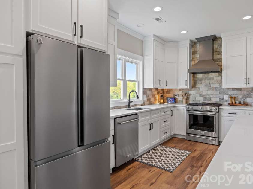 147 Haystack Lane, Olin, NC 28660.  MLS# CAR4375441, YatesRealty ID 23772. Room enough for everyone to gather in this kitchen